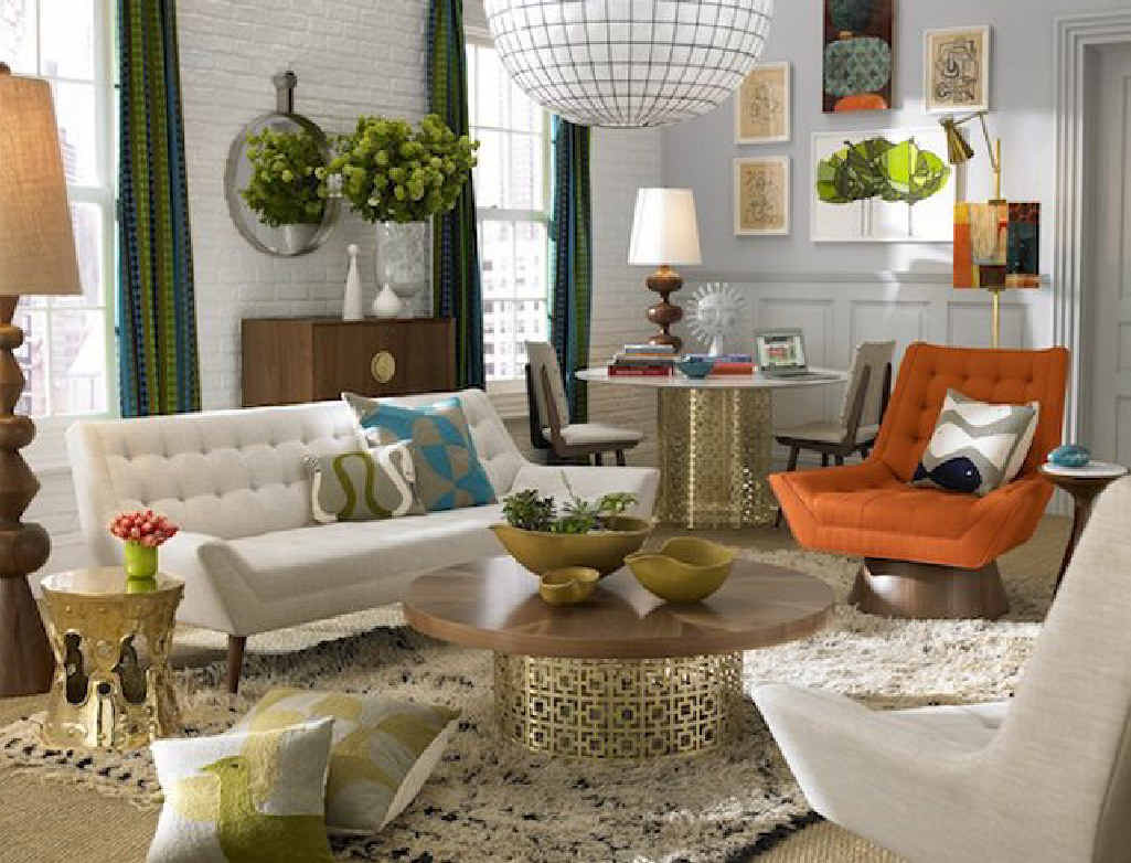 Interior designer Jonathan Adler adds a touch of opulence to this home with gold tables and table lamp. Interior designer Jonathan Adler adds a touch of opulence to this home with gold tables and table lamp.